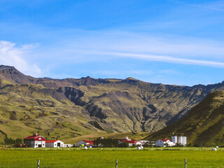 Small farm in front of a mountain near Eyjafjallajökull in Iceland