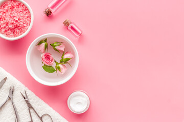 Professional manicure tools with pink roses flowers. Beauty care salon spa.
