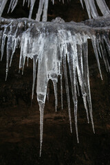 Sharp icicles hanging from a cave