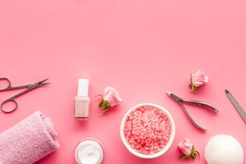 Pink roses flowers and manicure tools. Beauty nail care spa salon.