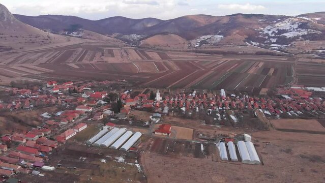Coltesti village and church seen from a drone at winter, aerial view