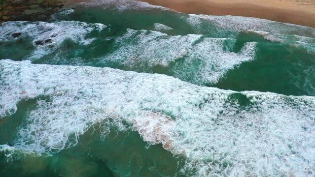 Aerial top down drone shot of the beach and ocean riptide currents at south Bondi beach Australia
