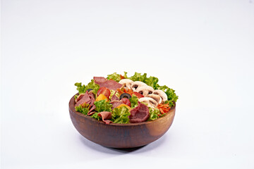 shrimp salad on a wooden bowl on isolated white background