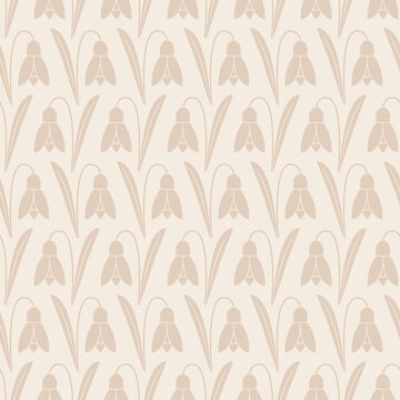 Seamless Pattern of beige snowdrop flowers on a cream background.
