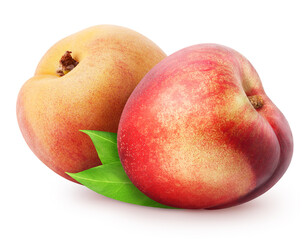 Isolated nectarines. Two whole nectarine fruits with leaves isolated on white background