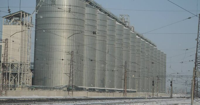 Industrial facilities. Elevator building with huge grain storage tanks. The town of Iskitim, Siberia. Hand held.
