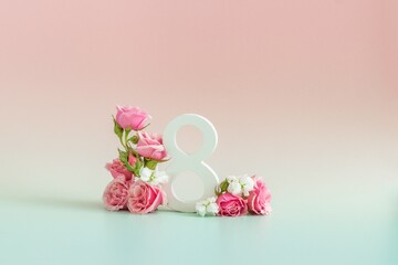Background postcard for Women's day march 8, eight with pink flowers on pastel background 