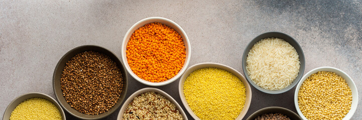 Various grain cereals in bowls banner, top view