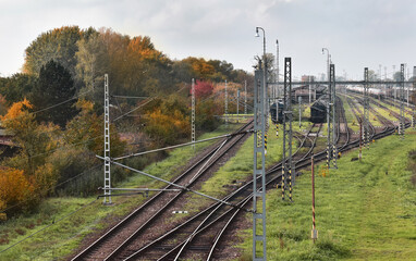 Railway tracks at the station, autumn landscape