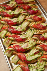 Bruschetta with red fish and fresh cucumber on a plate. Appetizing starter.