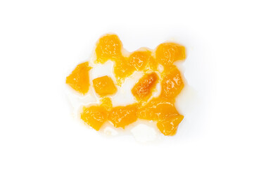 Peach jam isolated on a white background. Top view, flat lay.