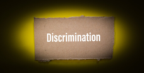 Discrimination word written on ripped paper