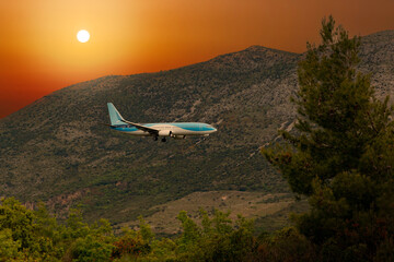 Airplane landing in Dubrovnik airport (Cavtat) on a sunset time.