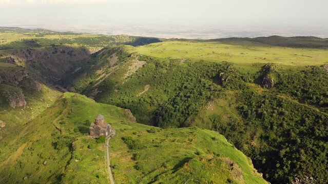 Aerial view over Church of Vagramashen on slope of Mount Aragats in Armenia. Travel attractions  in Armenia.