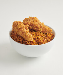 Instant noodles with fried chicken. Korean style fast food isolated on white background