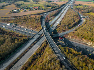 Rush Hour Vehicles Driving on a Motorway Interchange UK Aerial View