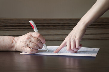An old woman is forced to write a will for an apartment