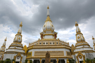 Fototapeta na wymiar Beautiful towers of the Buddhist pagoda at Wat Pha Nam Thip Thepprasit Wanaram temple Roi Et, Northeast Thailand