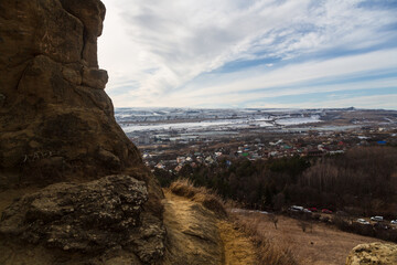View over the countryside from Mountain Ring in Kislovodsk, Stavropol Krai, Russia. Landscape of picturesque rock and sky in winter nature, travel, hike and tourism in Caucasus Mineral Waters