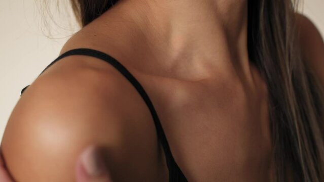 Close up of collarbone of unrecognizable woman in underwear. Shot with RED helium camera in 8K. 