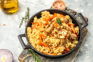 pilaf. Traditional oriental dish of boiled rice, meat, vegetables and spices. Restaurant menu, dieting, cookbook recipe top view