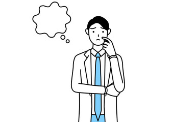 顔をかきながら考える白衣を着た男性医師