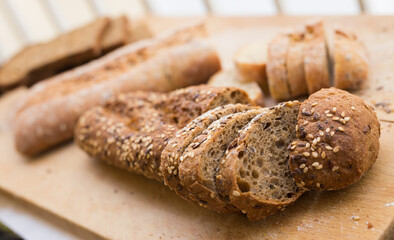 fresh loaf of bread on wooden board