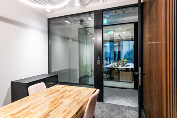 An elegant office with glass doors and a large window to the corridor. A place for business...