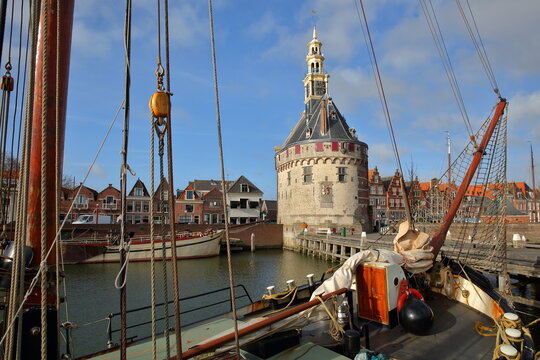 The harbor (Binnenhaven) of Hoorn, West Friesland, Netherlands, with the Hoofdtoren (The Head Tower) and old wooden sailing boats