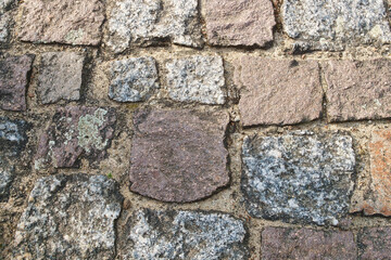 cobblestone natural stone with sand joints. Background image. Stone floor