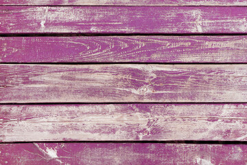 Wooden background. Old pink painted wooden plank surface, aged weathered cracked boards. Grunge shabby texture, wallpaper, backdrop
