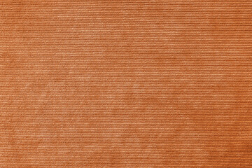Texture background of velours orange fabric. Upholstery velveteen texture fabric, corduroy...