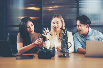 Group team work programer and engineer working AI robot arm system.  Business people Start-up...