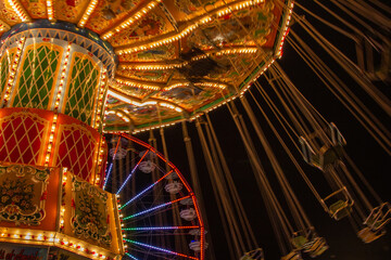 Large and victorian decorated carnival ride with swings