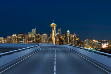 Obraz premium Empty urban asphalt road exterior with city buildings background. New modern highway concrete construction. Concept way to success. Transportation logistic industry fast delivery. Seattle. USA.