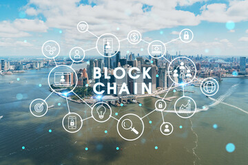 Aerial panoramic helicopter city view on Lower Manhattan district and financial Downtown, New York, USA. Decentralized economy. Blockchain, cryptography and cryptocurrency concept, hologram