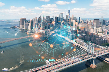 Aerial panoramic city view of Lower Manhattan. Brooklyn and Manhattan bridges over East River, New York, USA. Decentralized economy. Blockchain, cryptography and cryptocurrency concept, hologram