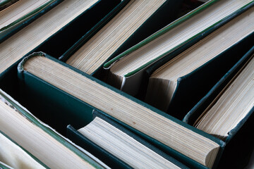 numerous books with green covers