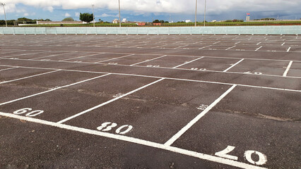Empty parking lot - numbered parking spaces in drive-in