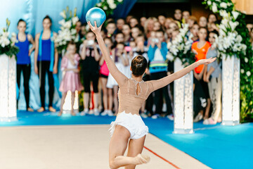 rhythmic gymnastics performance with ball girl gymnast
