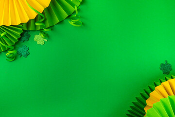 St Patrick flatlay background with shamrock clover leaves, leprechaun hat decor, golden coin, party...