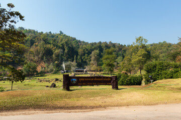 Doi Pha Hom Pok National Park sign named in Thai language, in front of Fang Hot Spring, Fang District, Chiang Mai, Thailand.