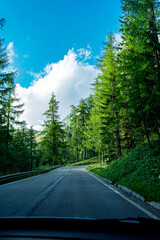 Fototapeta na wymiar Road to mountains in Italy Dolomites. View from the car