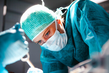 Woman operating on a neurosurgical and maxillofacial procedure
