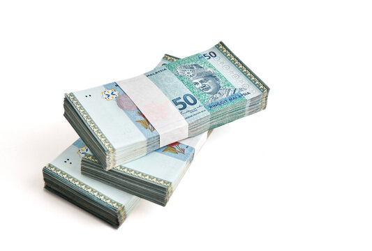 Stack of Ringgit Malaysia bank note on white background. Malaysia Currency Ringgit RM50