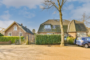 Brick house with green fence