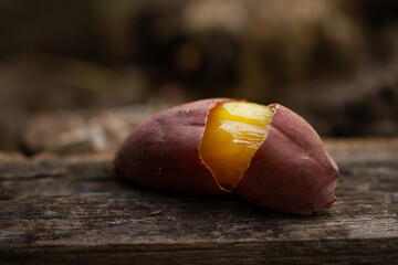 Bake Japanese sweet potato on wooden table.