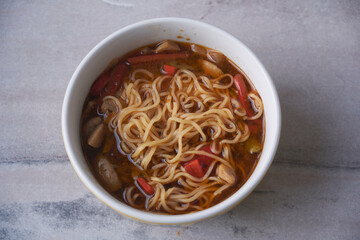 Noodles with mushrooms in macro shot