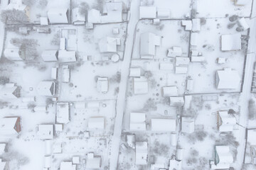 Snow-covered village. Aerial top view.