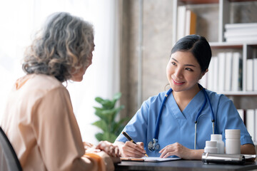 Asian female doctor examining a patient to assess the illness for proper treatment. - Powered by Adobe